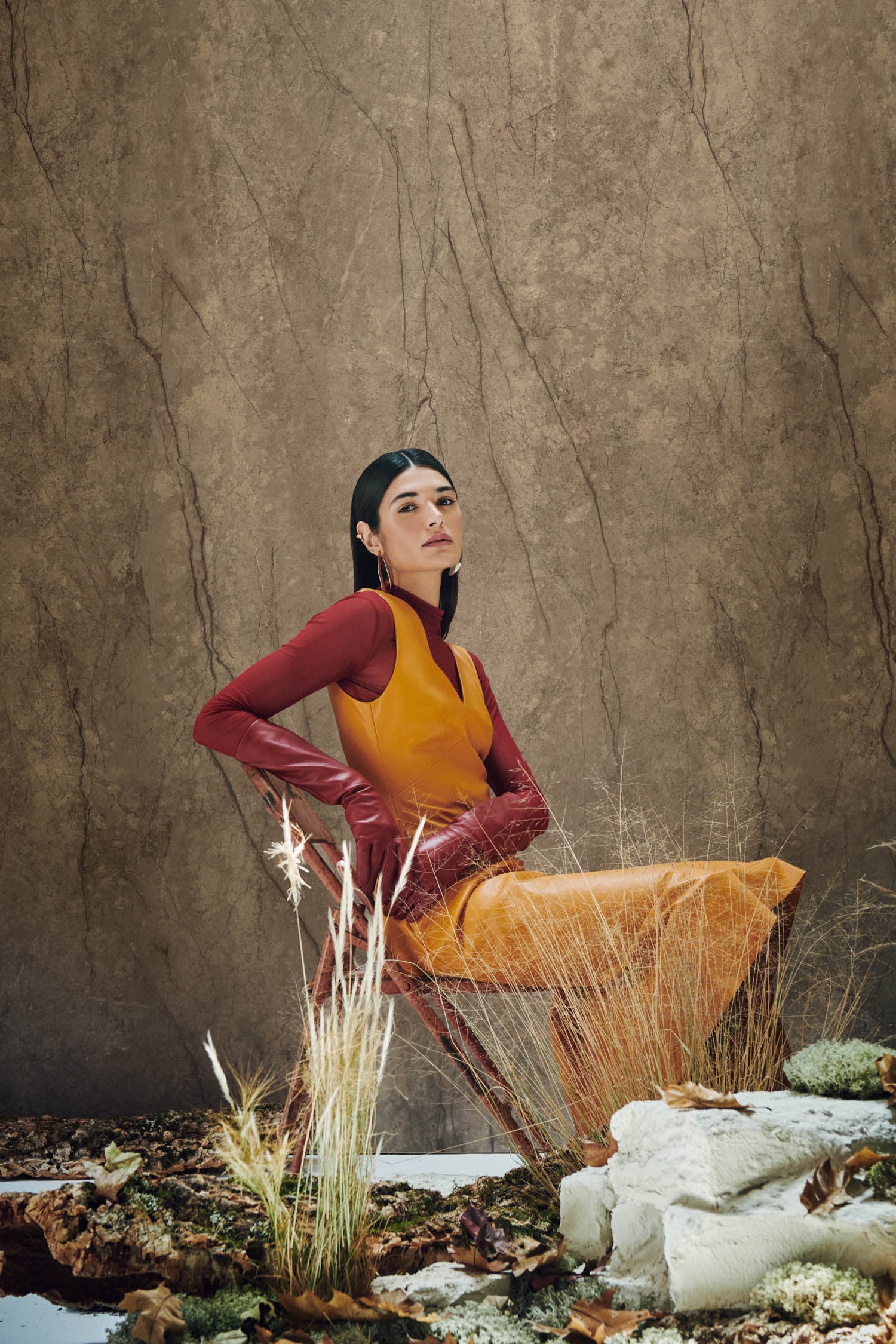 person sitting in front of wall covering