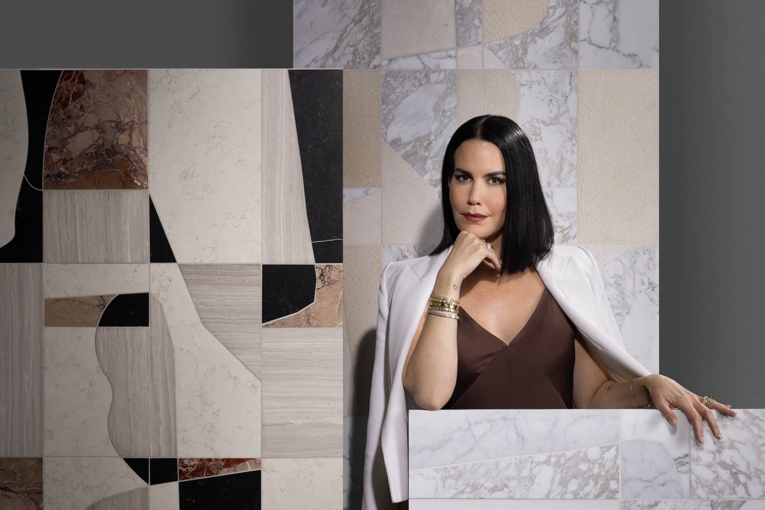 woman standing next to tile collection