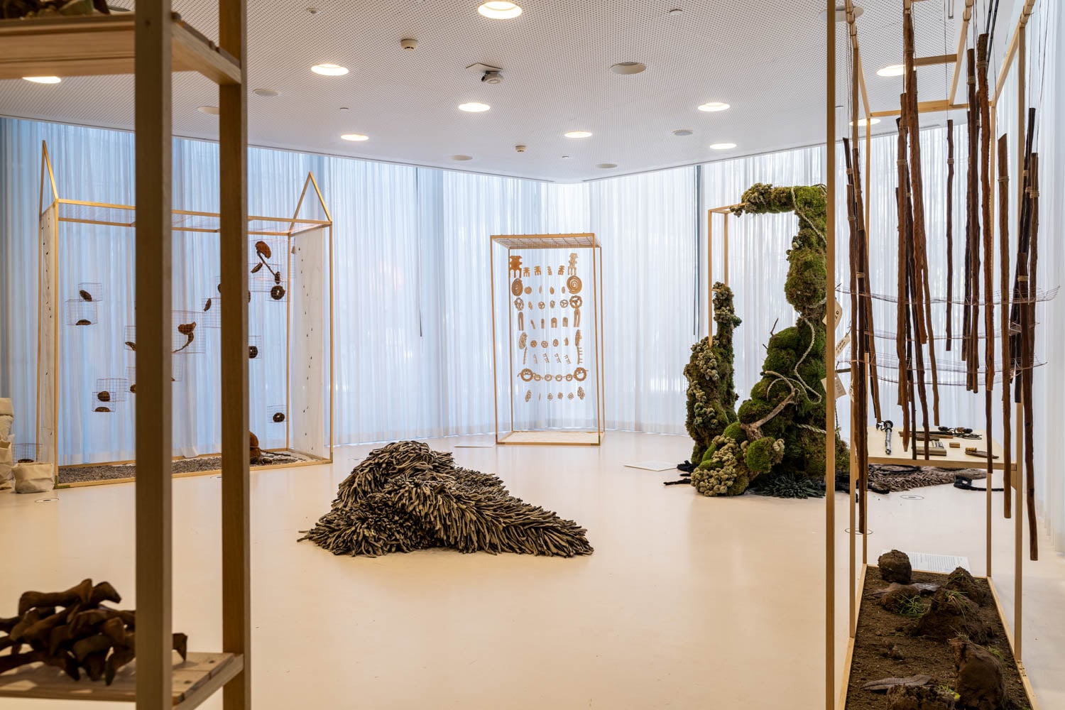 room with multiple grassy sculptures