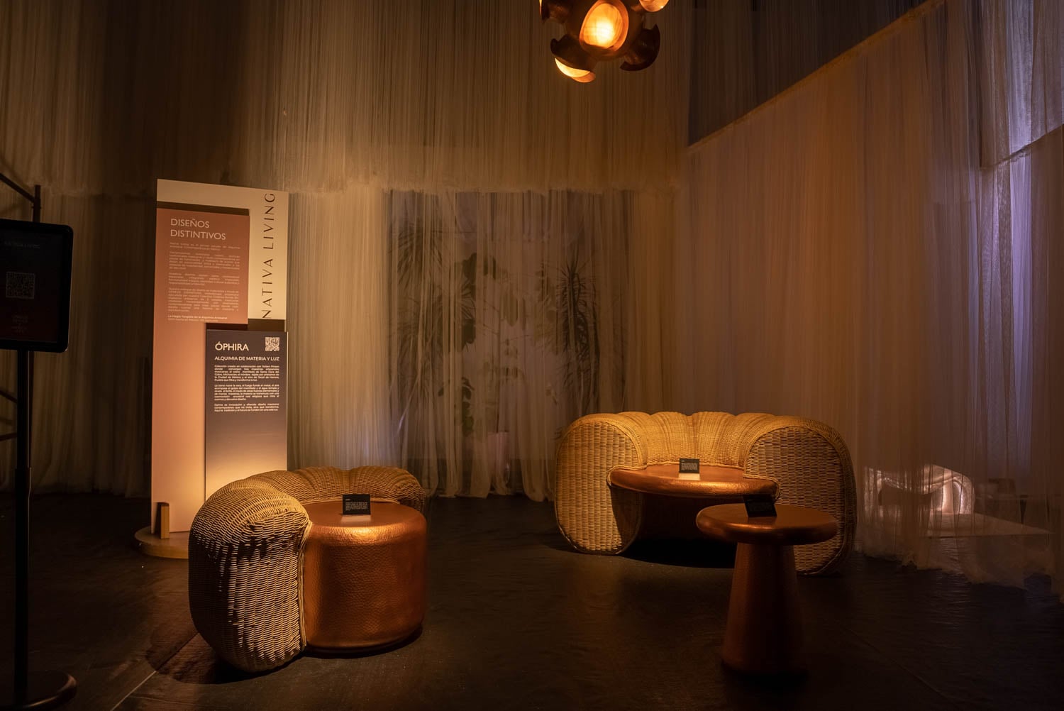 Cozy, dimly-lit room with wicker seating and warm lighting