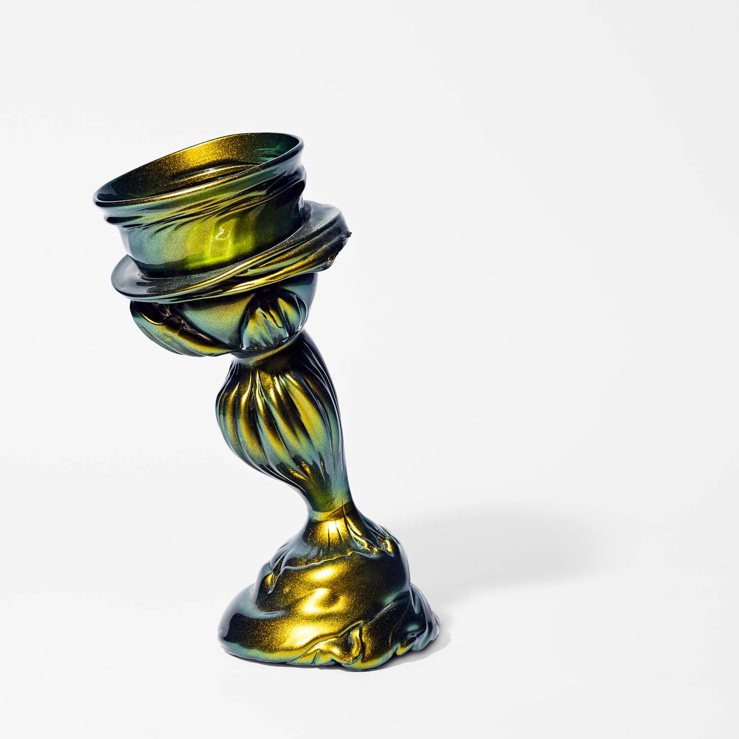 A twisted, metallic green and gold goblet with an abstract, flowing design