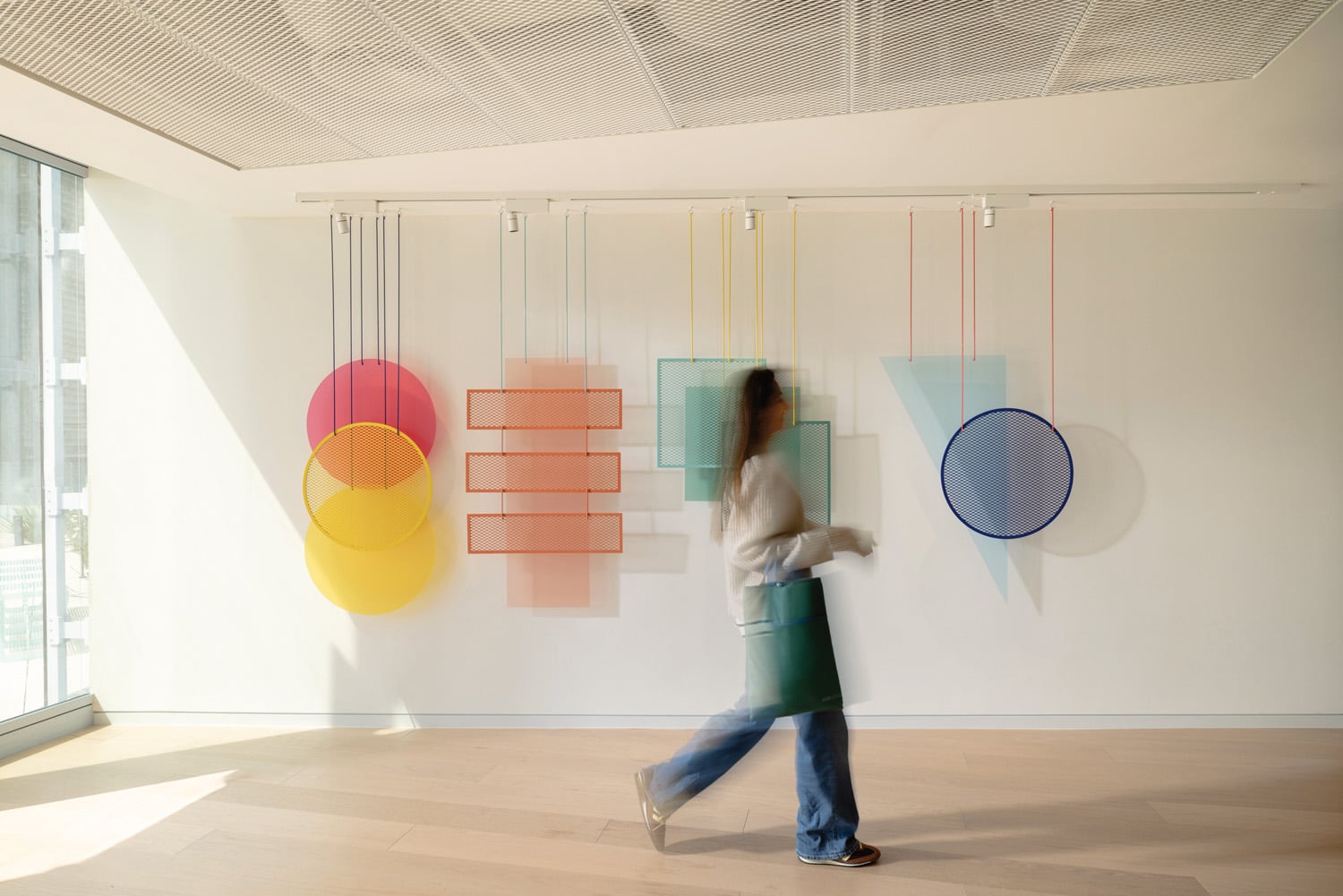 person walking through office hallway