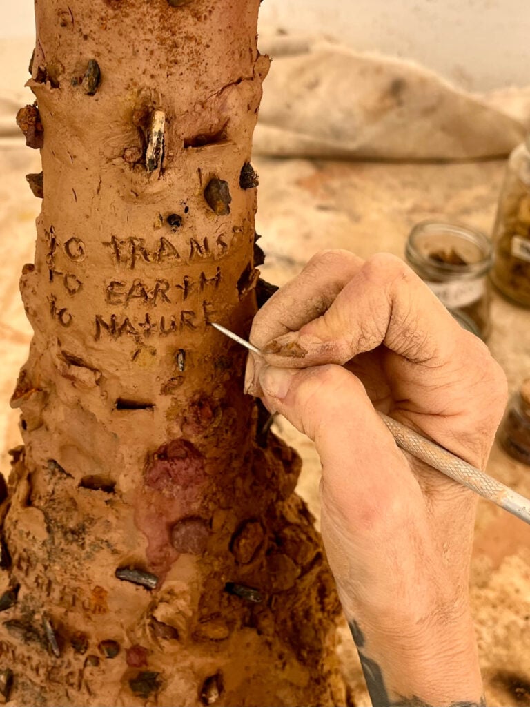 clay vessel with detail work being done