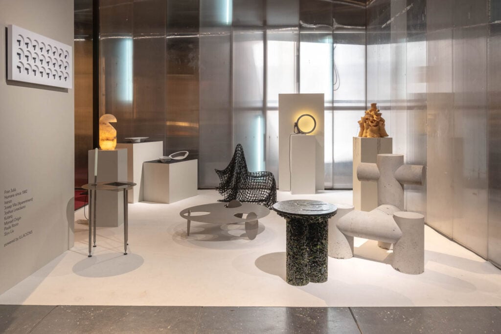 a white gallery space with furniture