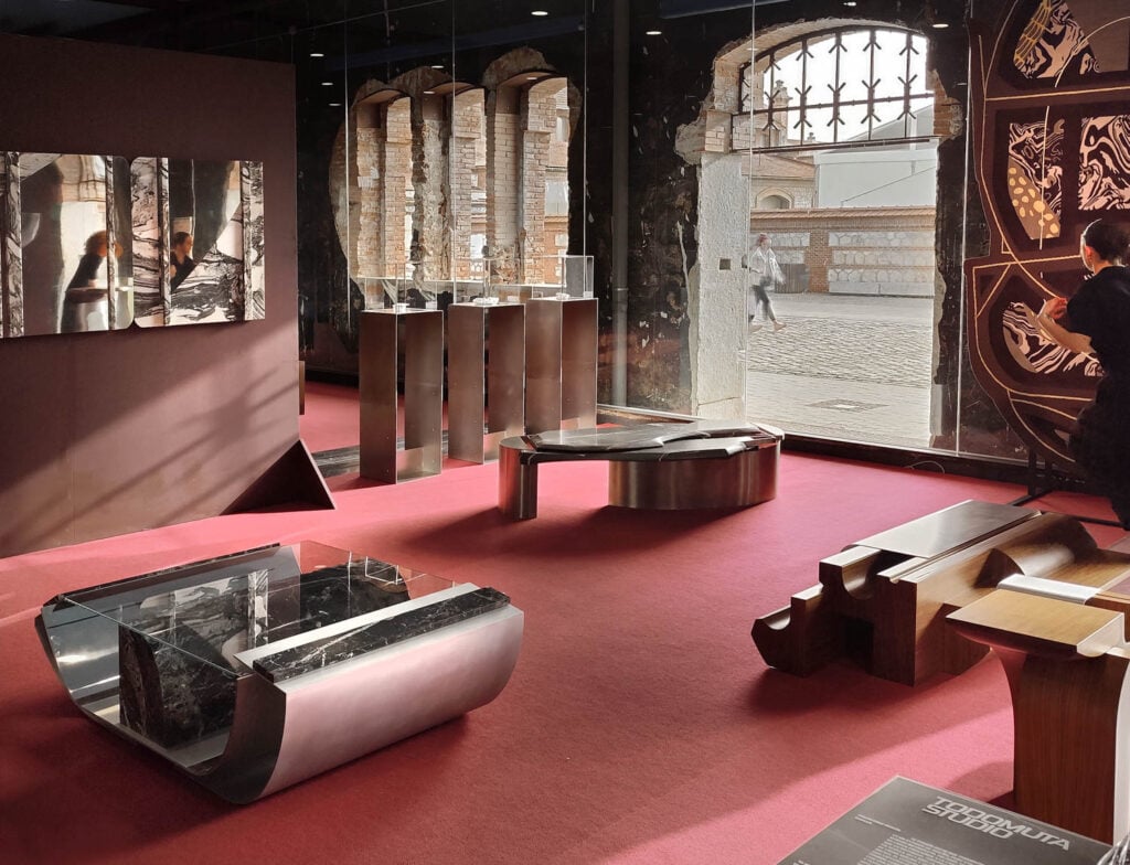 a room with red carpet and unique furnishings