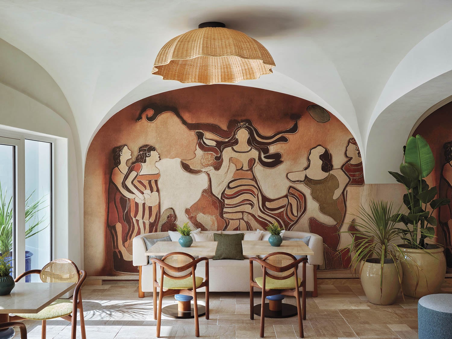 dining area with vibrant wall mural in w sardinia