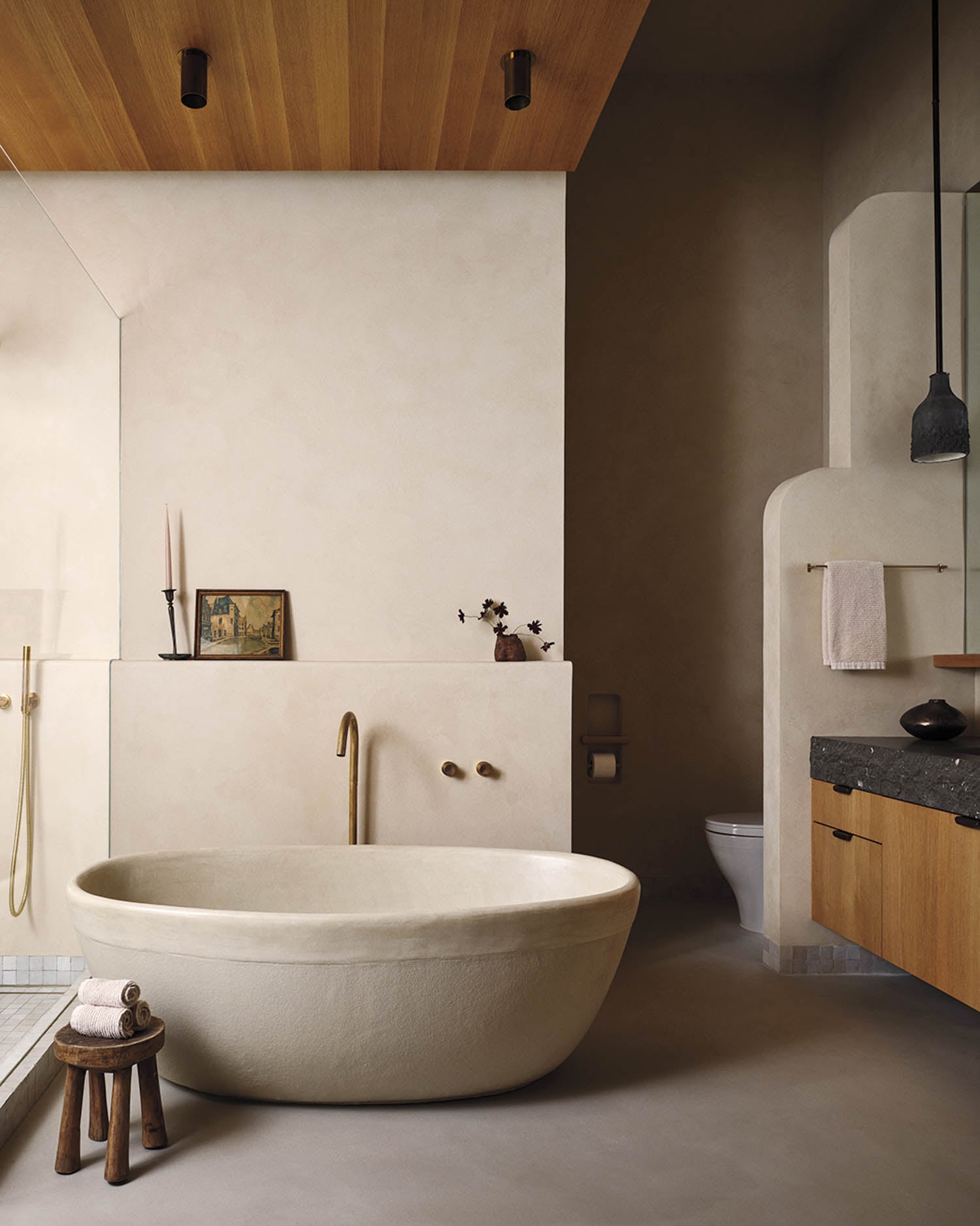 a white basin shaped bathtub
