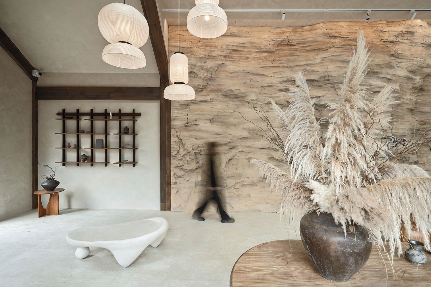 a room with a stone wall