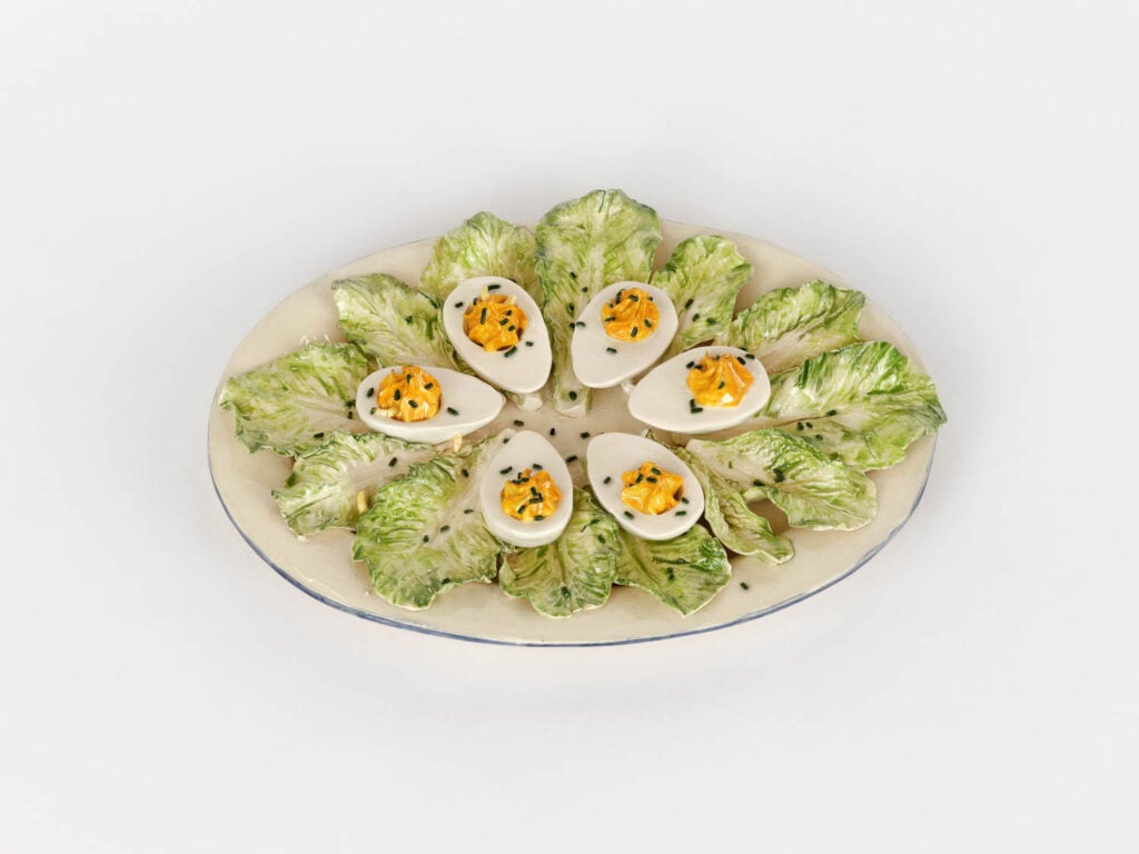 multiple deviled eggs on lettuce