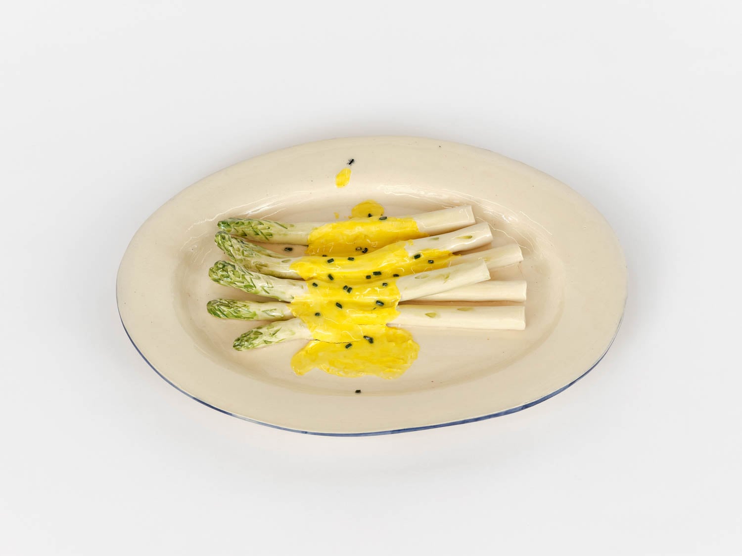 plate of asparagus in sauce