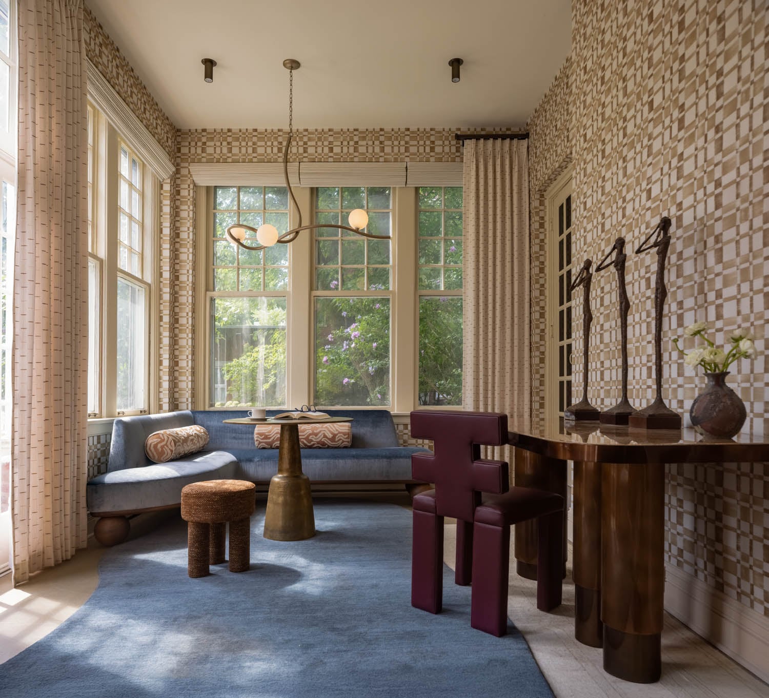 blue couch in room with chairs