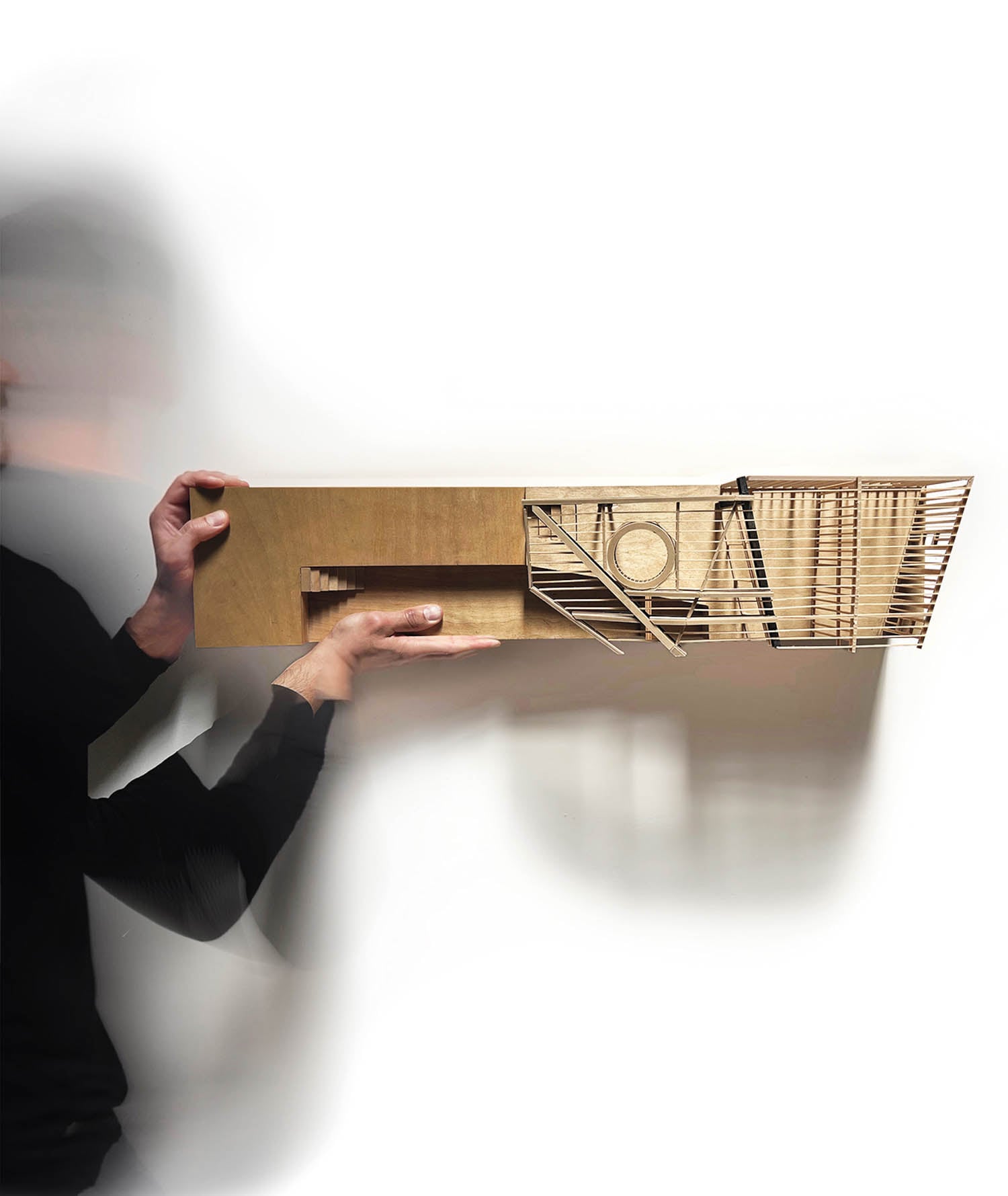 person holding up block