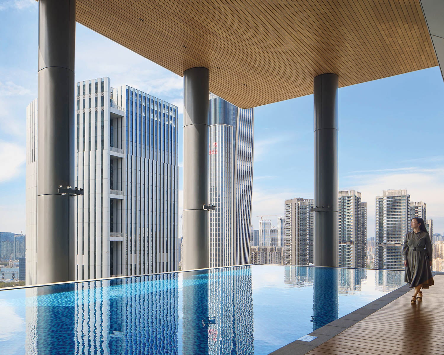 person walking corporate office interior design with pool