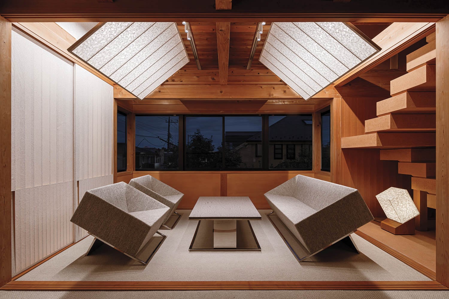 seating area with rectangular boxed seating and wooden stairs