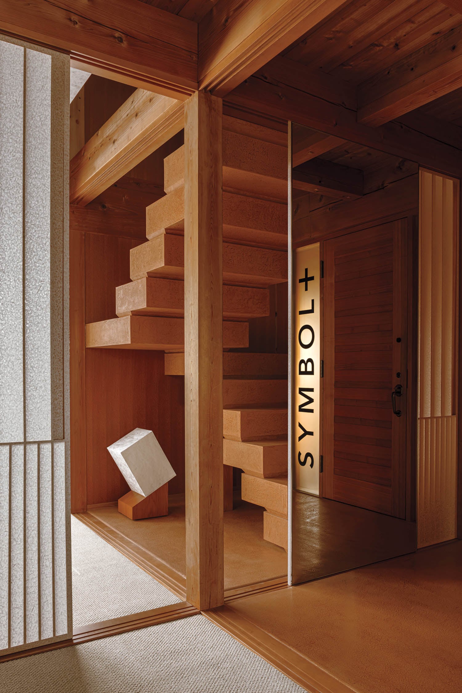 entryway to a room with a Symbol+ sign