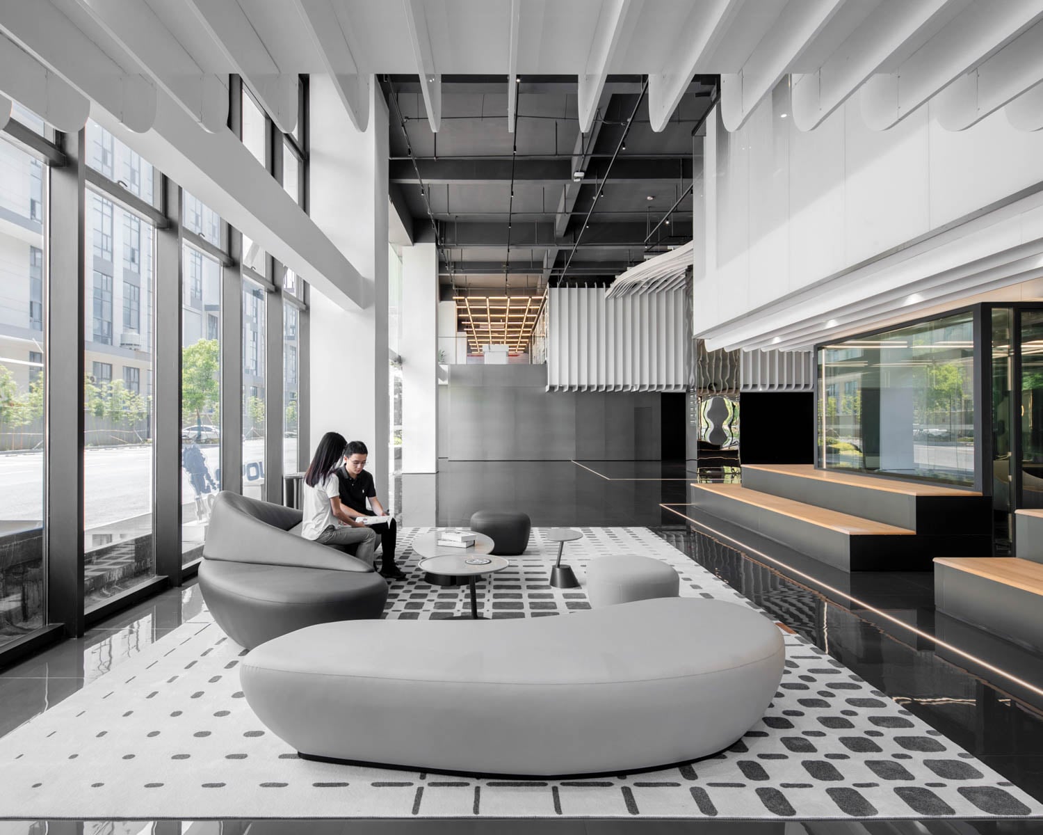 lounge area with curved couches in corporate office interior design