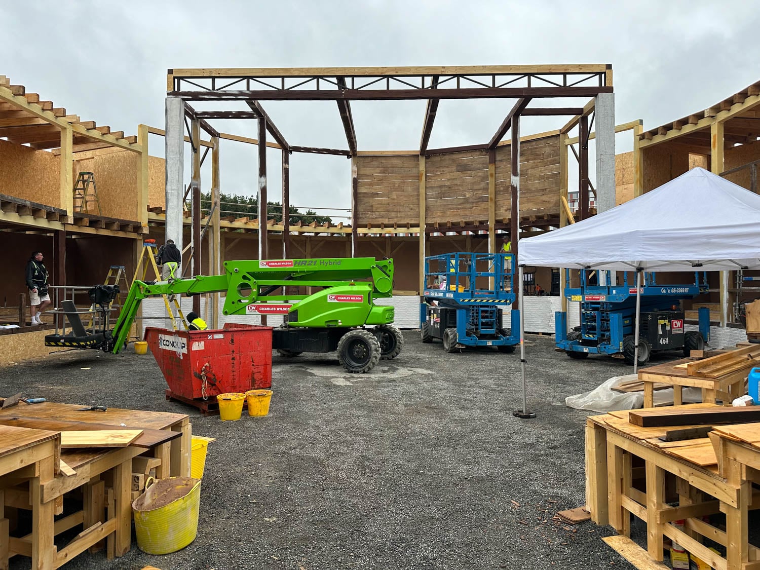 Construction site with wooden structures and metal framework