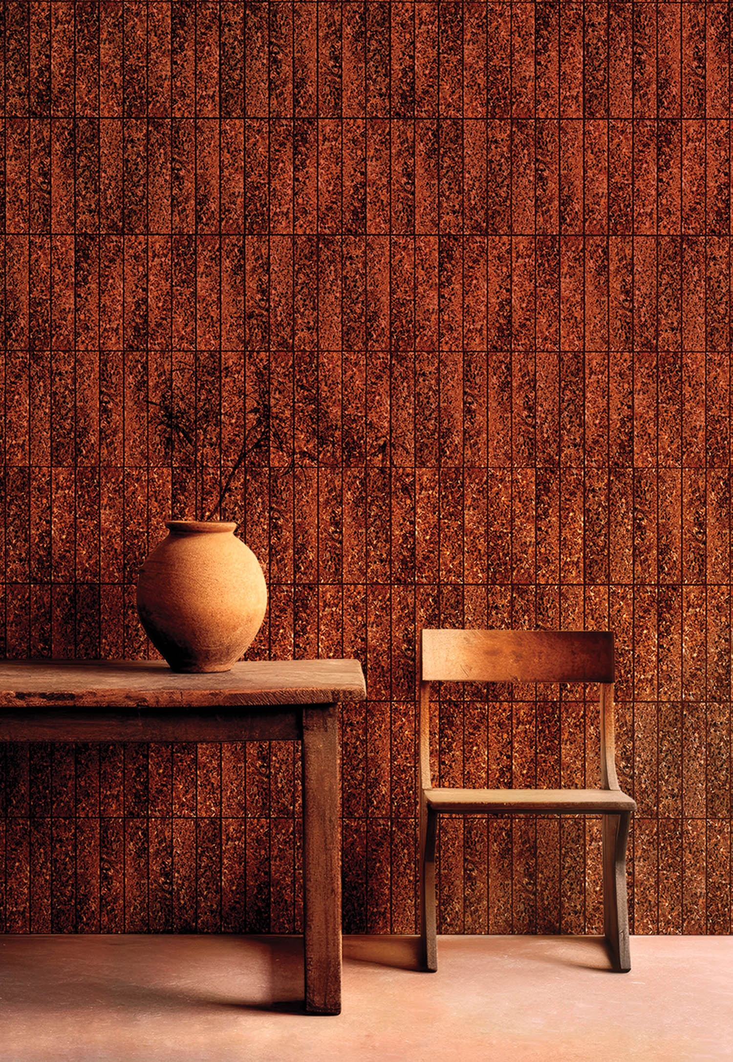 brown furnishings against red brick wall