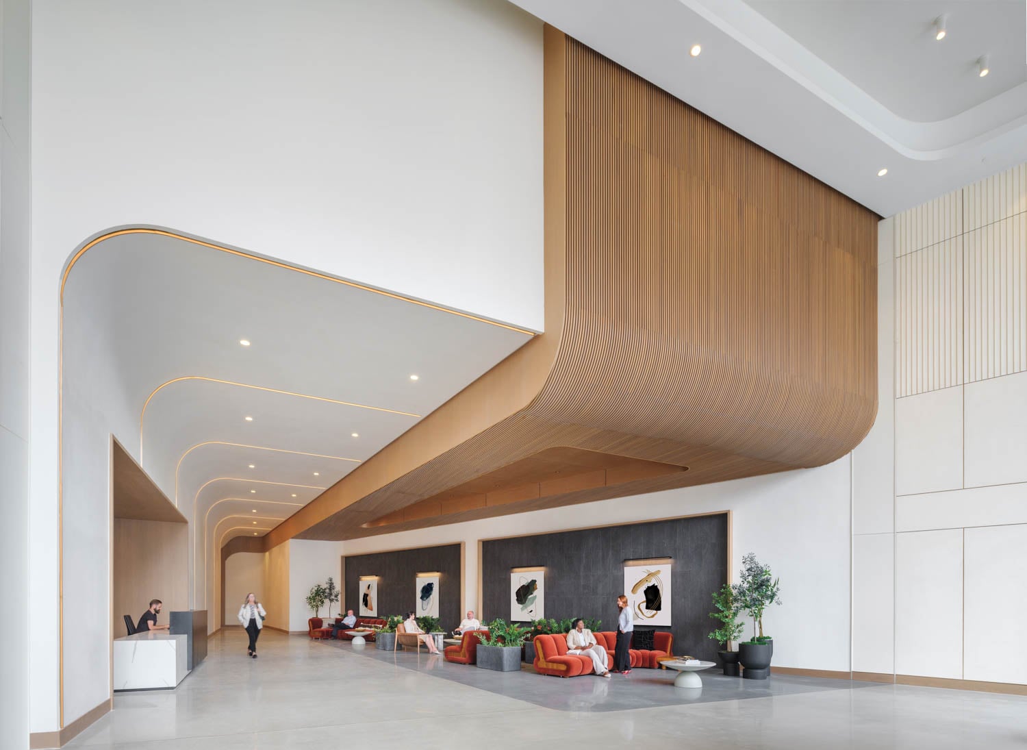 long hallway with multiple couches