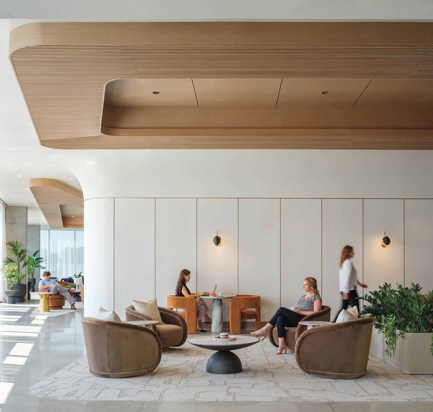 two people sitting at a lounge area