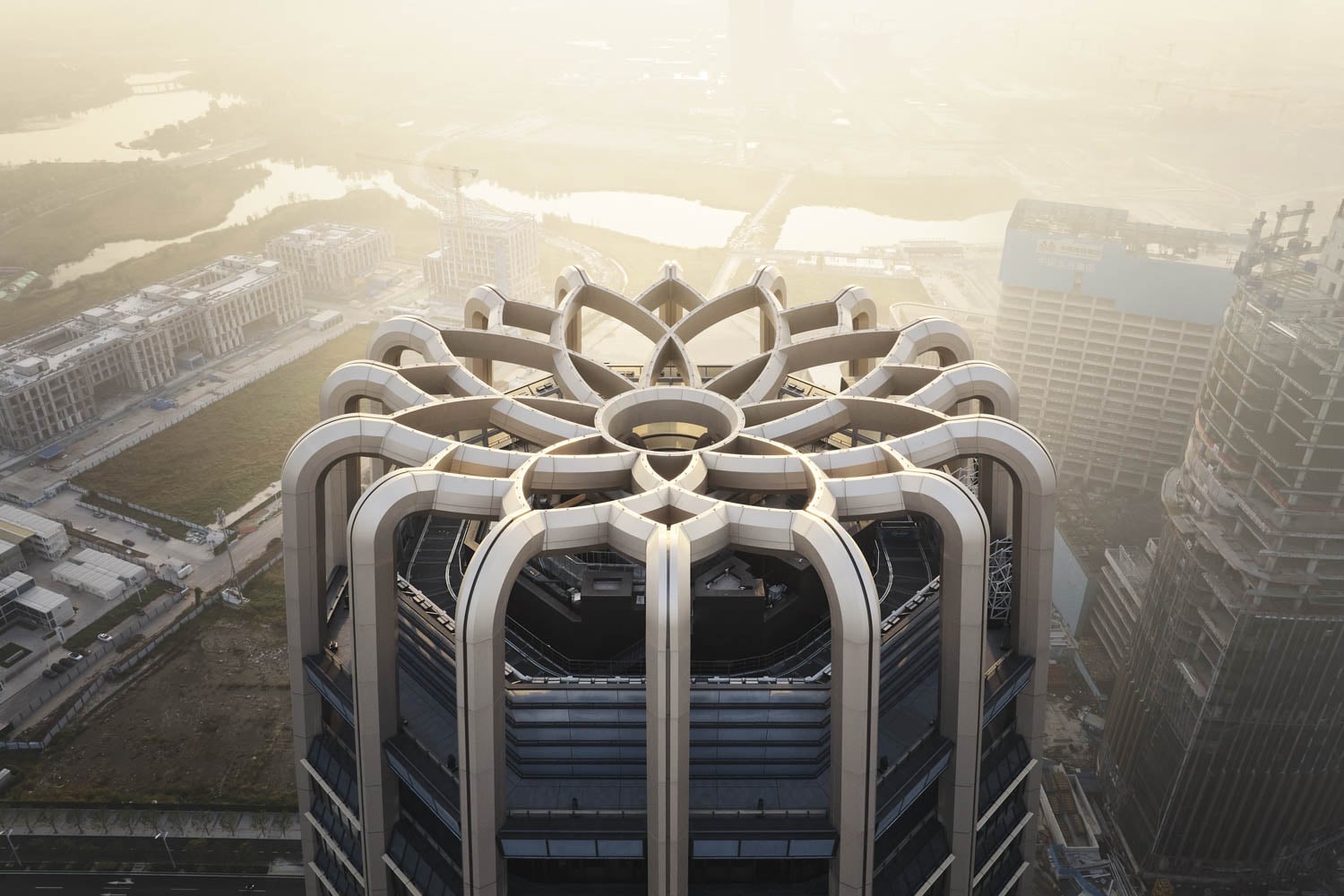 aerial view of building that's shaped like a flowr