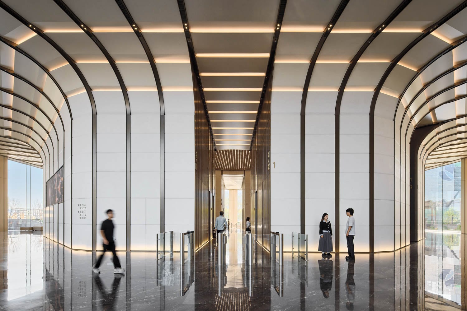 people walking in the lobby area of building