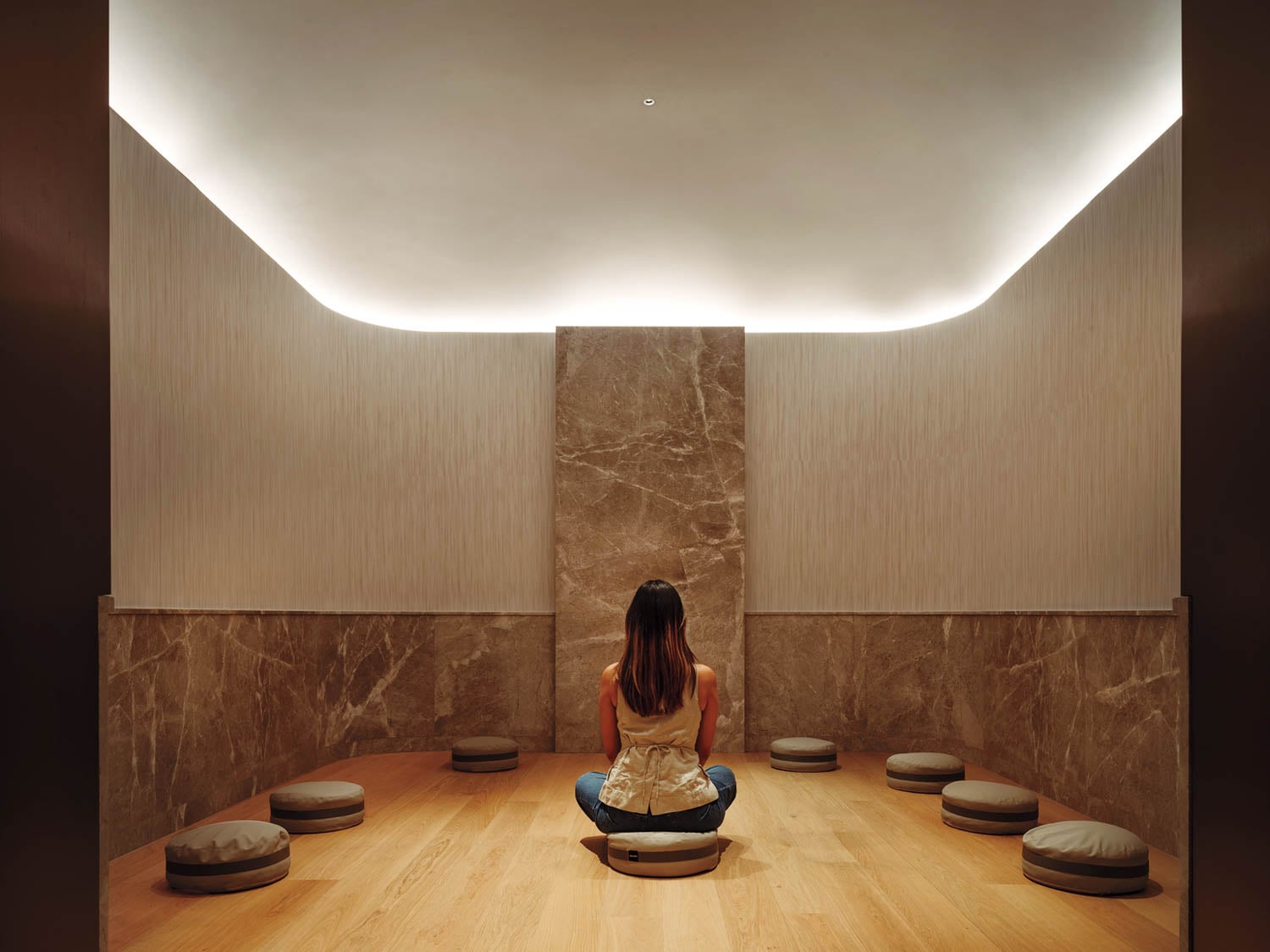 person sitting in meditation room