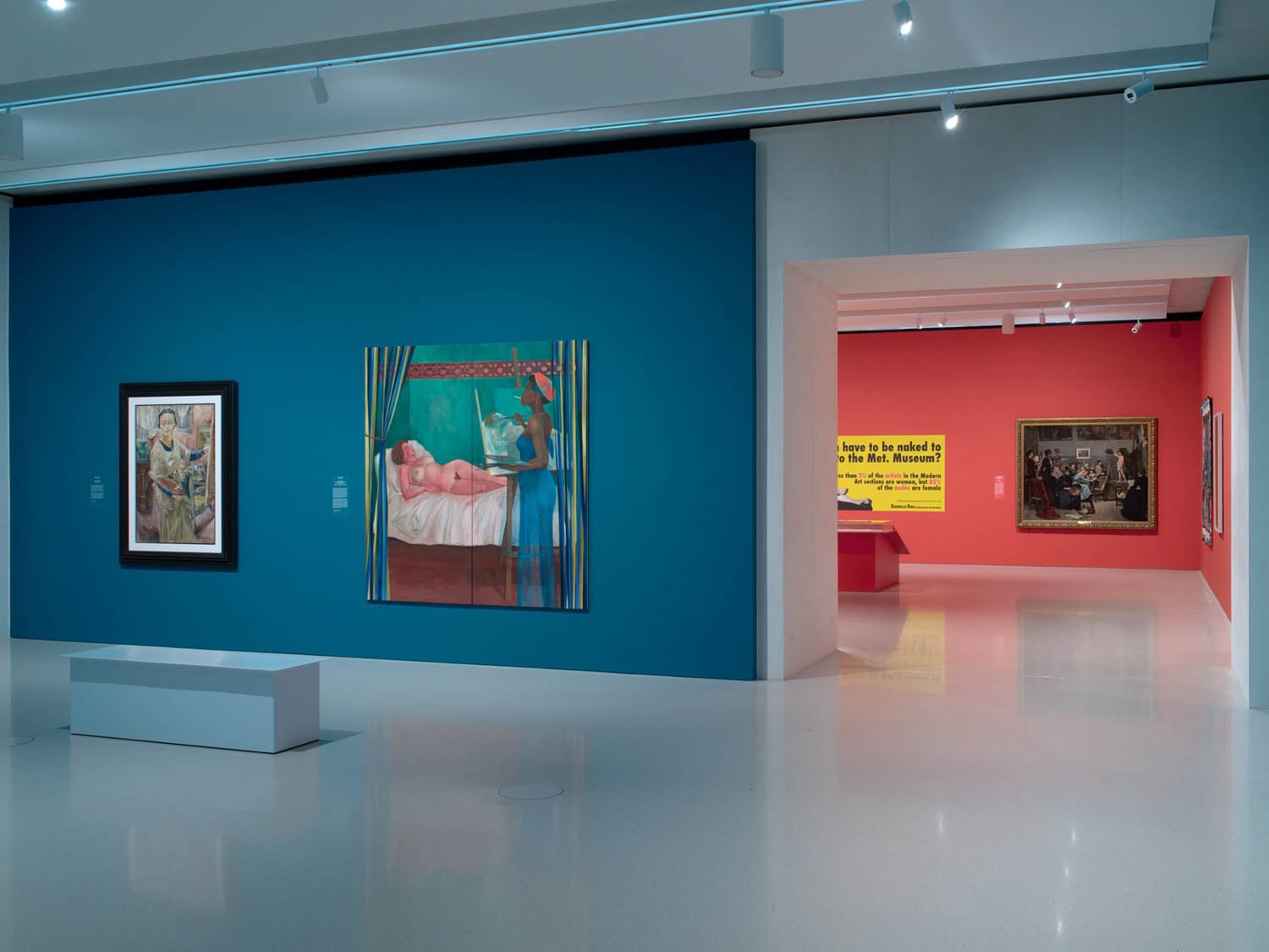 display area with blue walls and bench