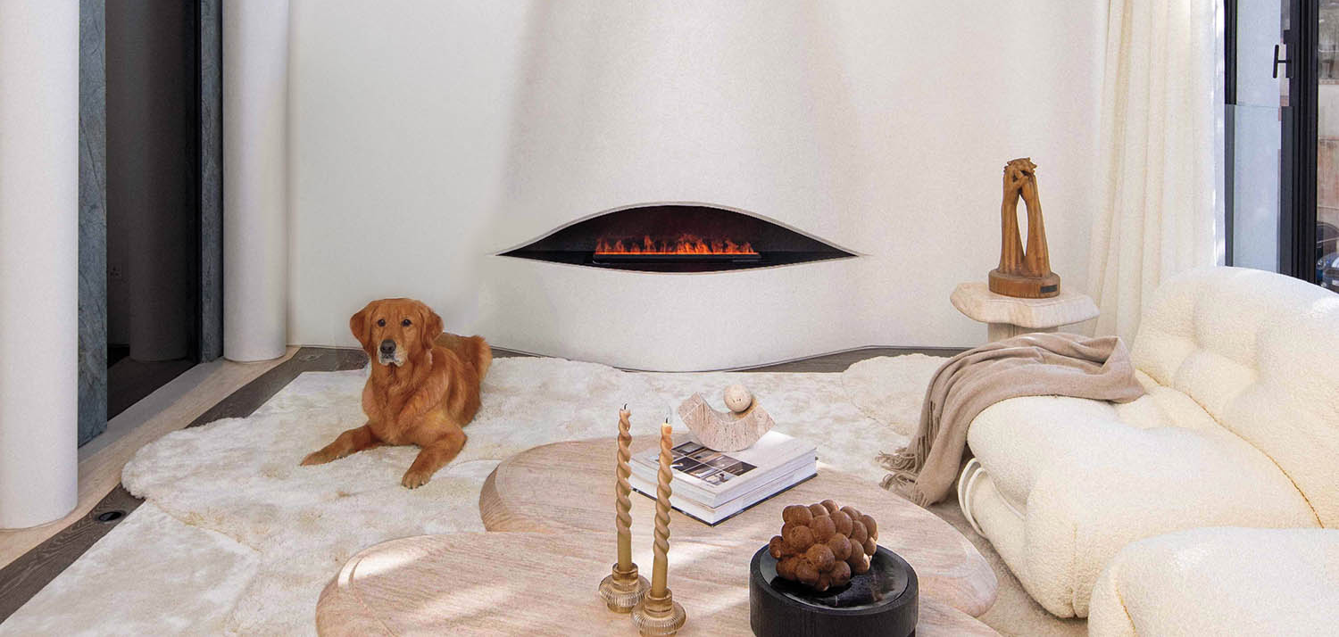 sitting area with couch, table and drapes