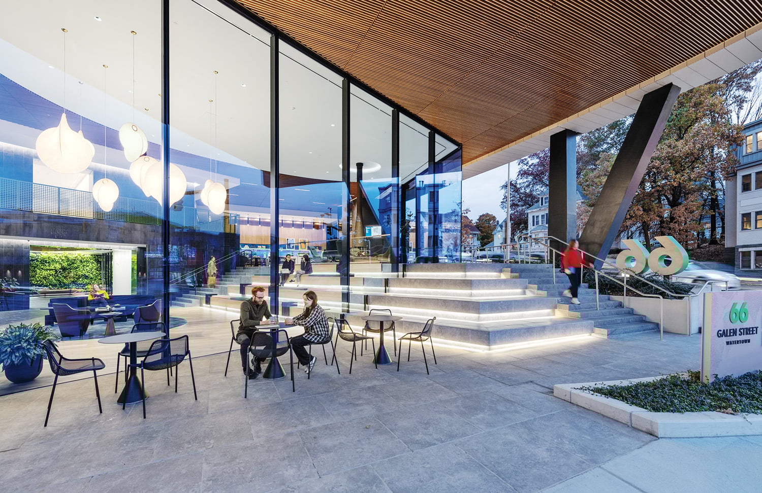 light streaming in through office with wall of windows