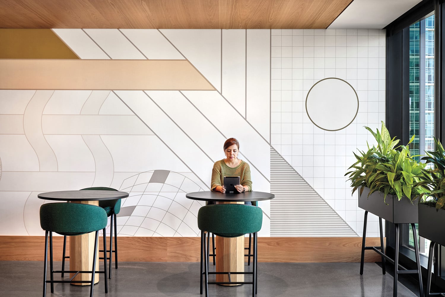 [erson sitting at small table