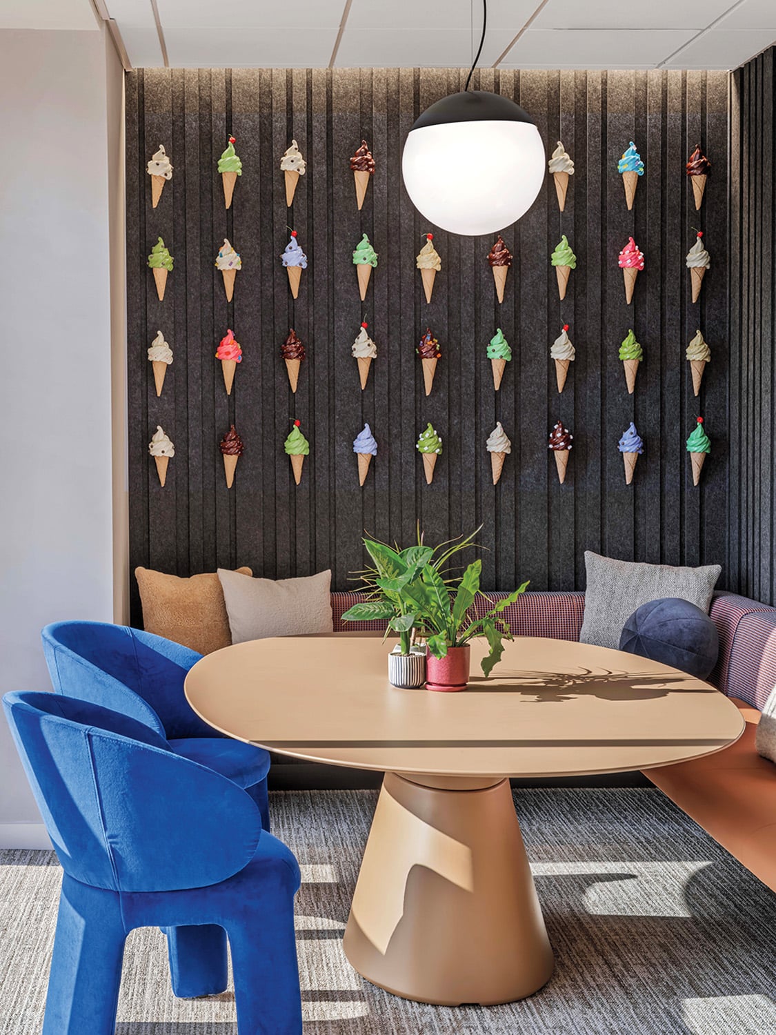round wood table with bright blue chairs