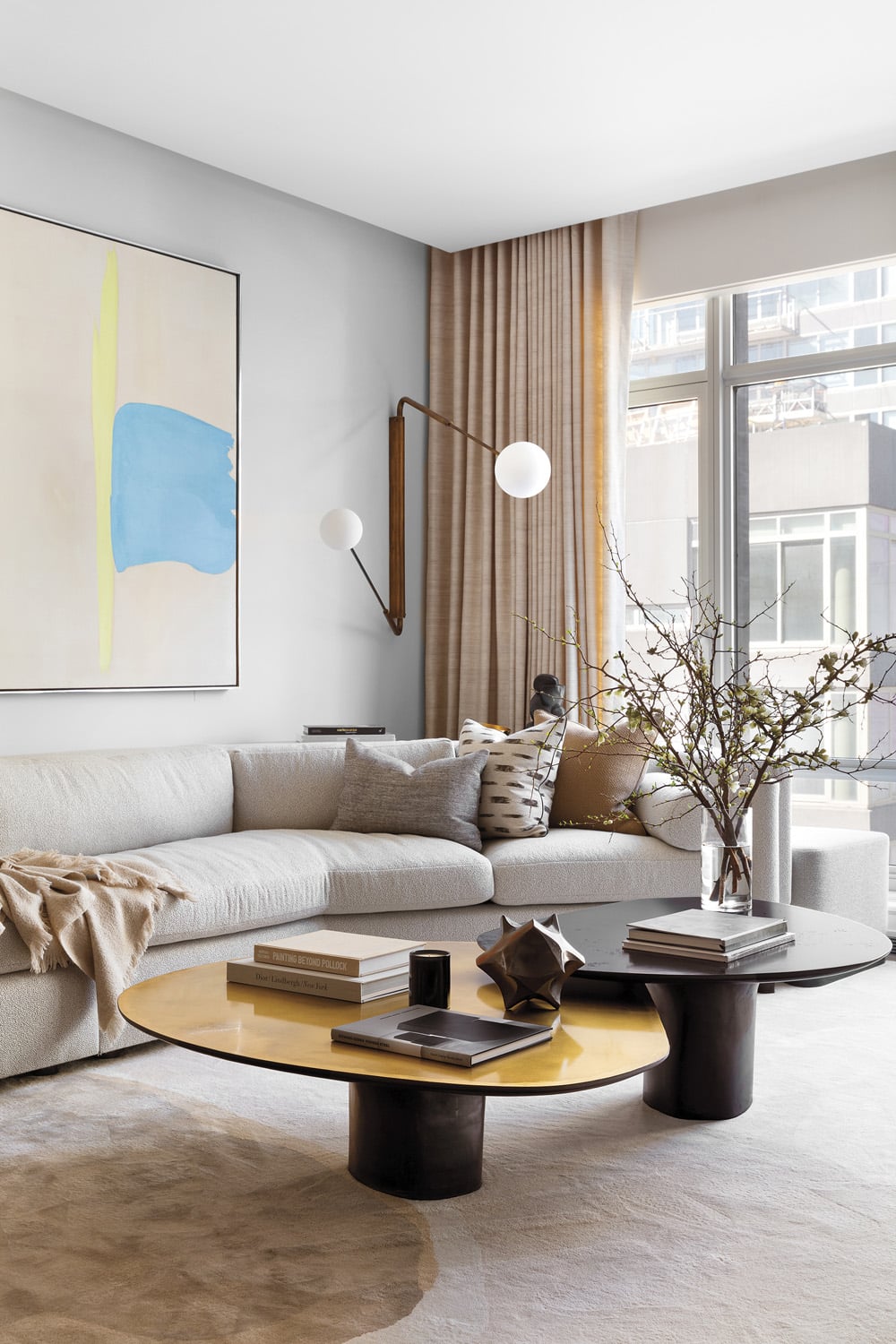 cream couch and wall with art