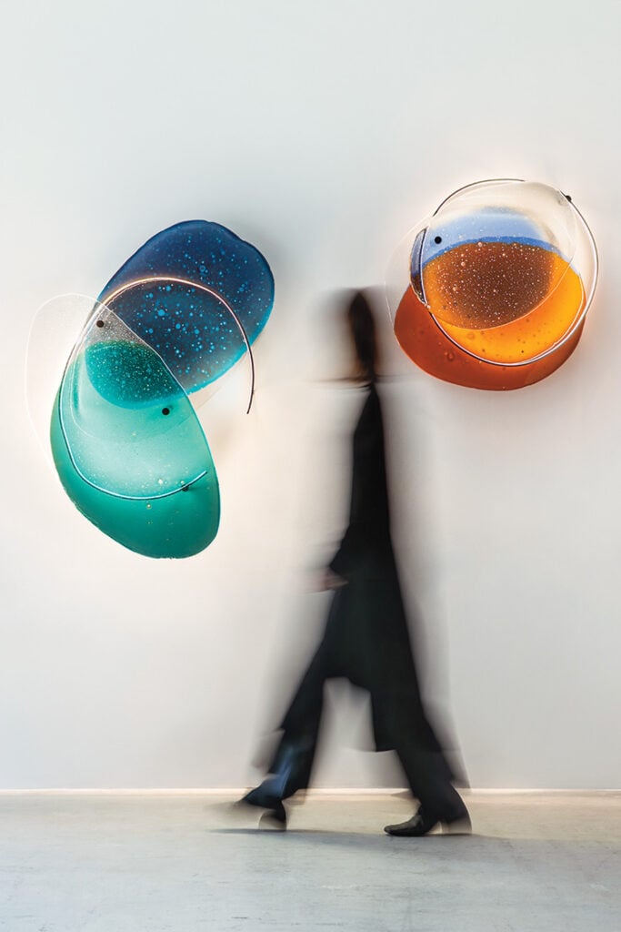 shadow of person near blue and orange lighitng