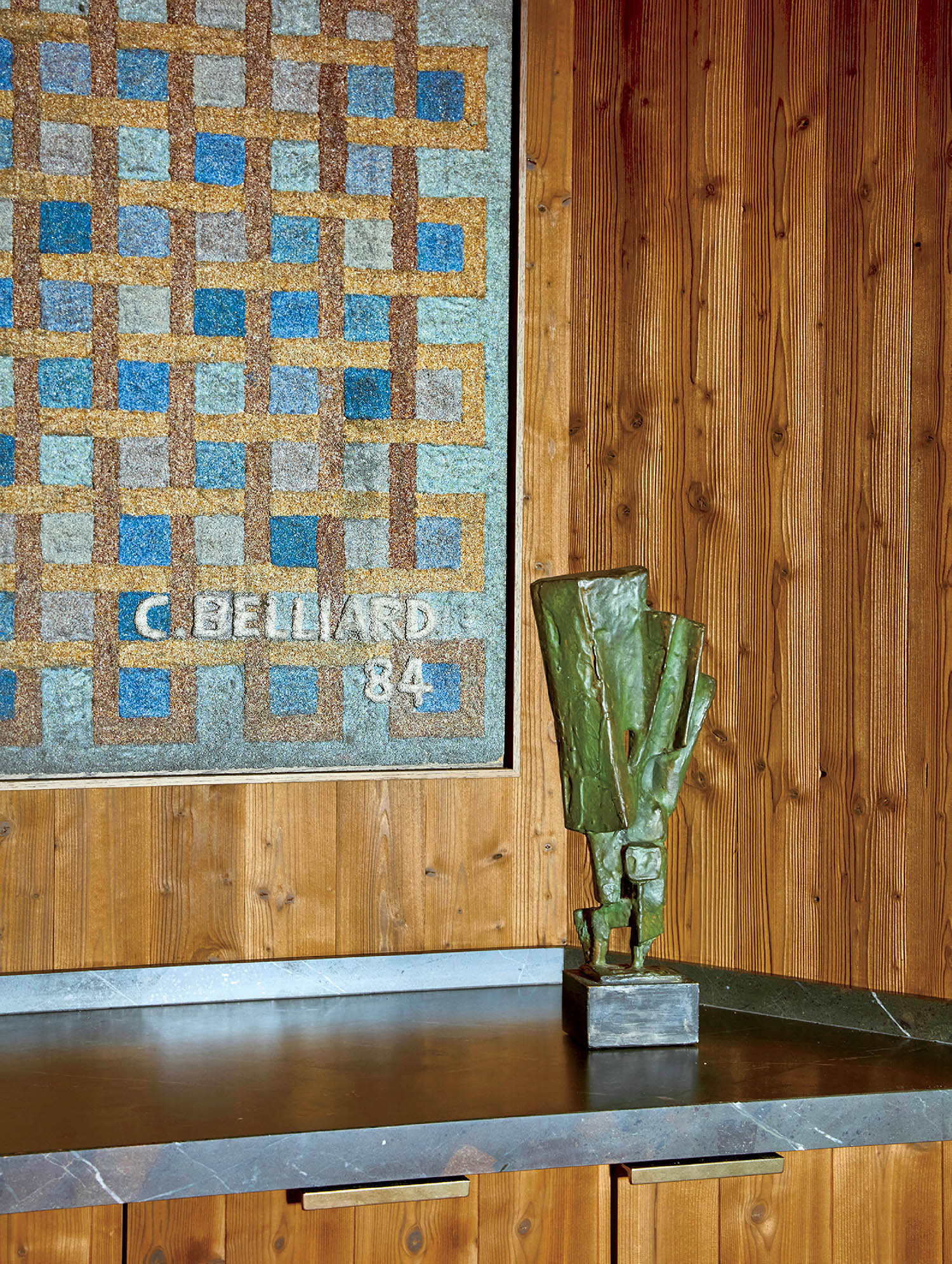 A vase with a green plant in it