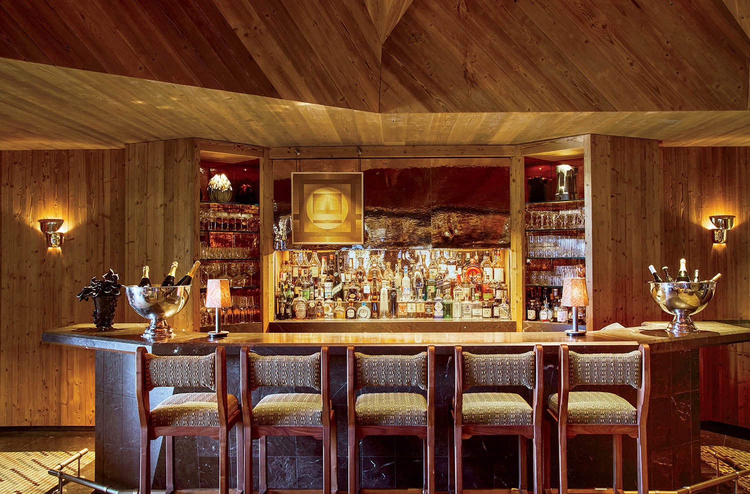 A bar with a bar stools and a bar.