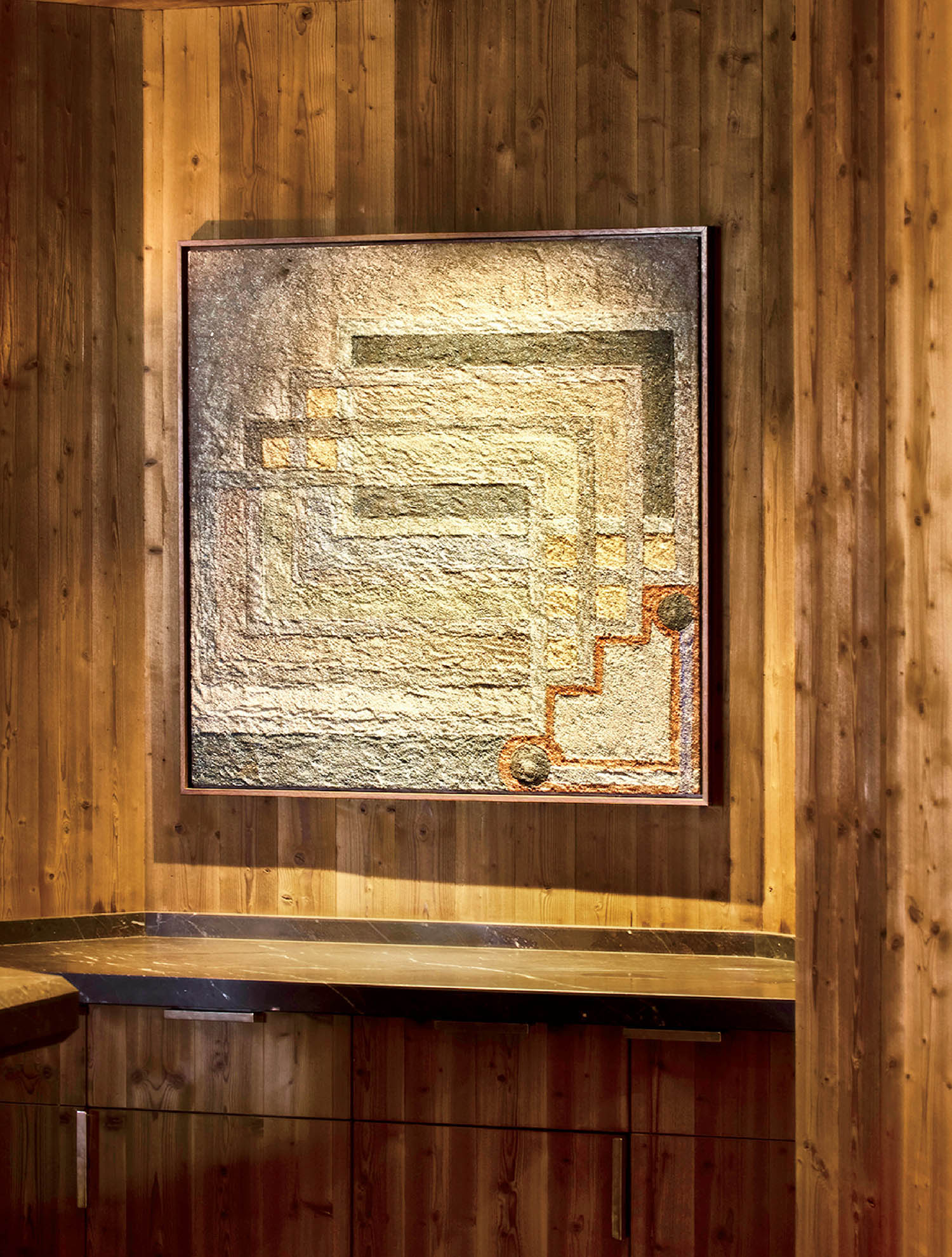 A picture of a brick wall in a room.