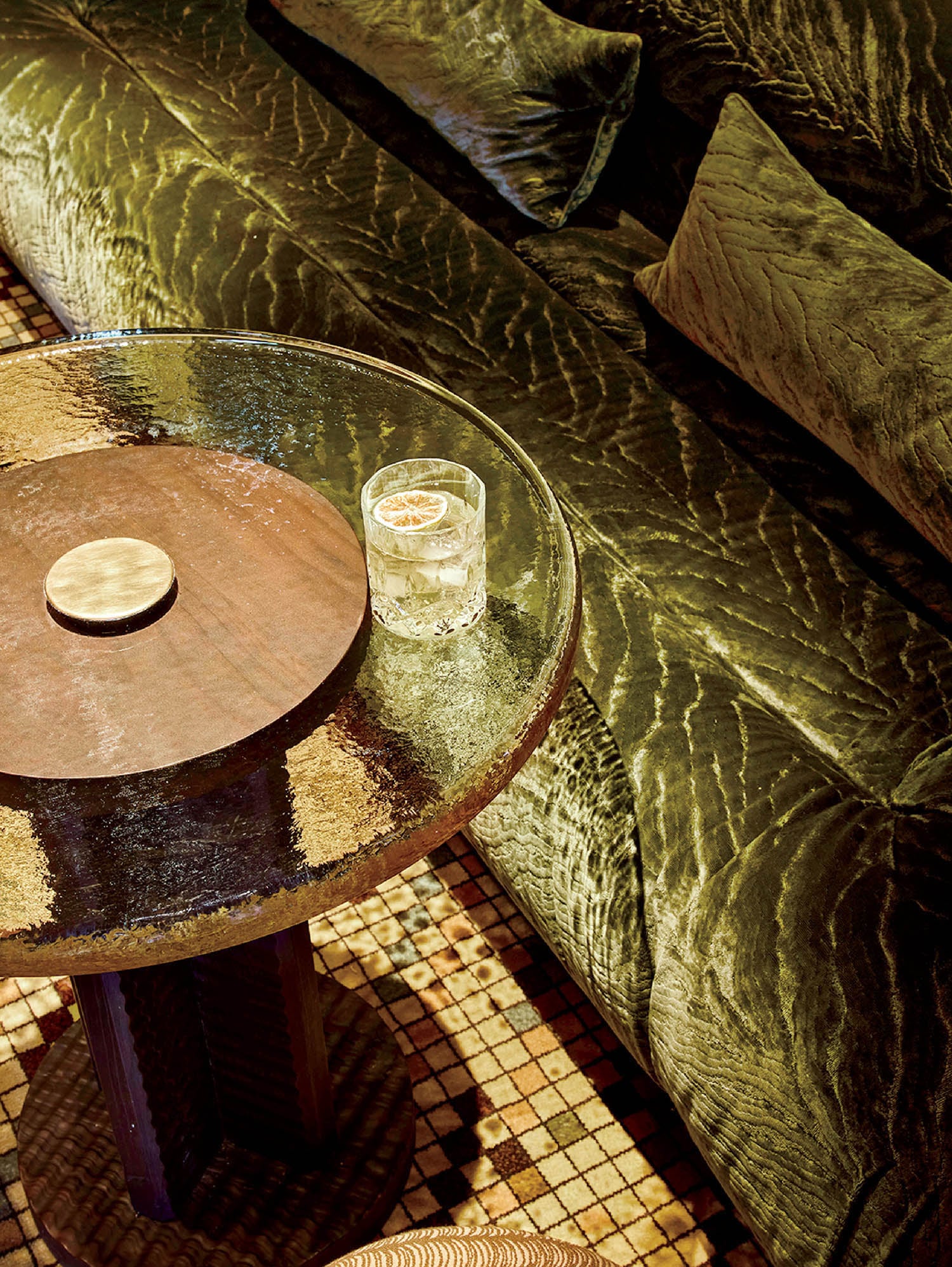 A bed with a table and a chair.