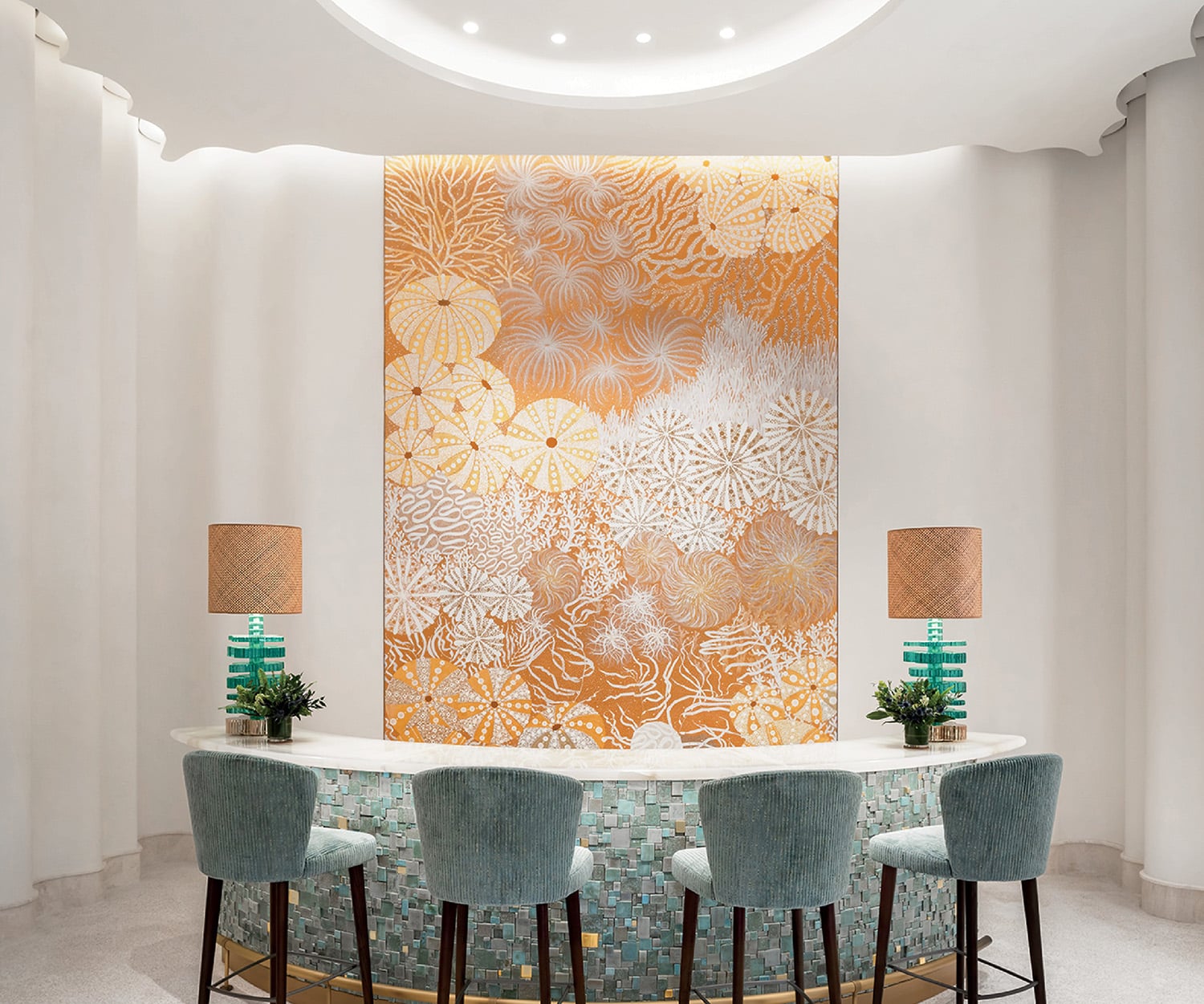 A room with a large wall mural and chairs