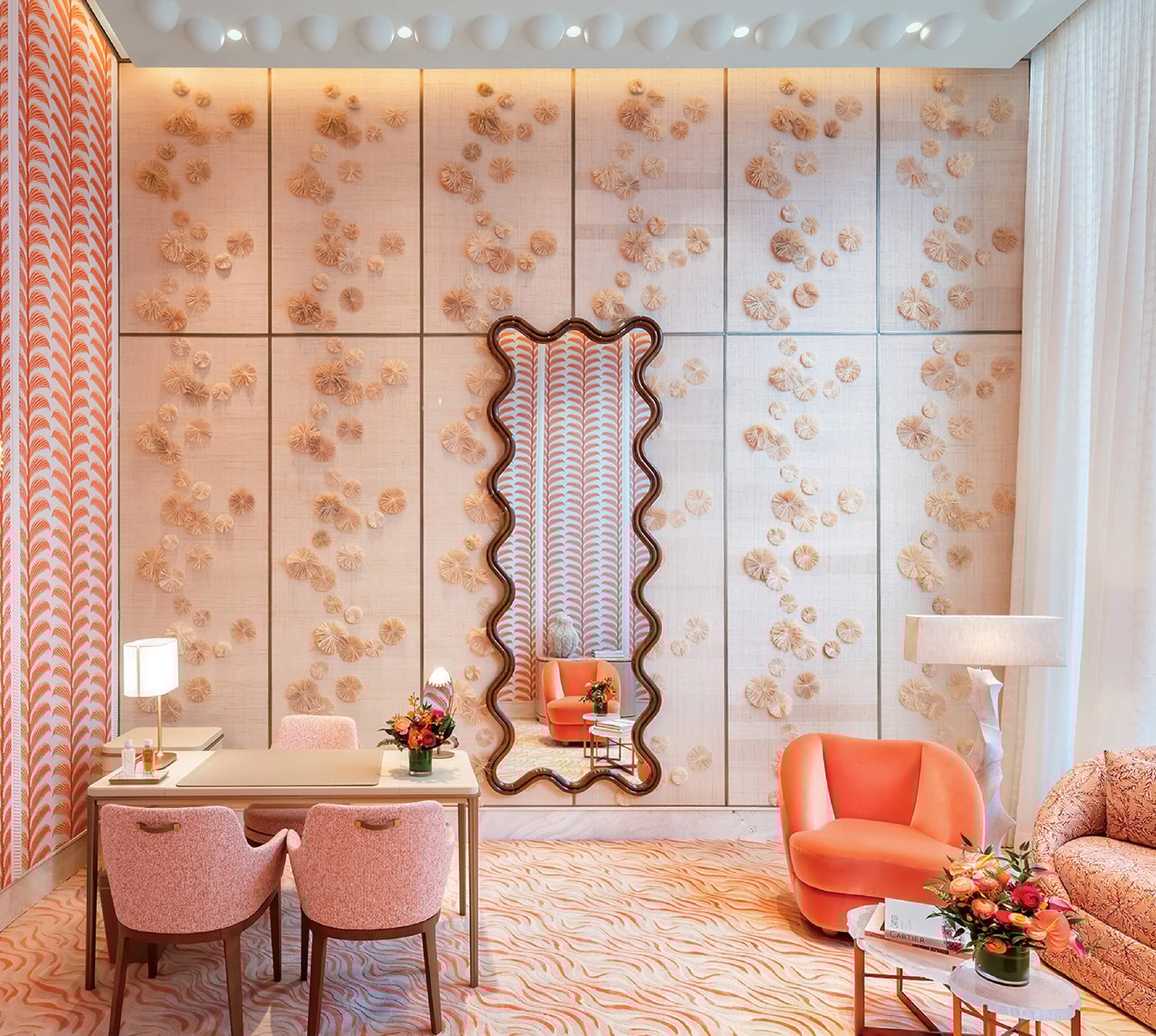 "A room with a table, chairs, and a mirror"