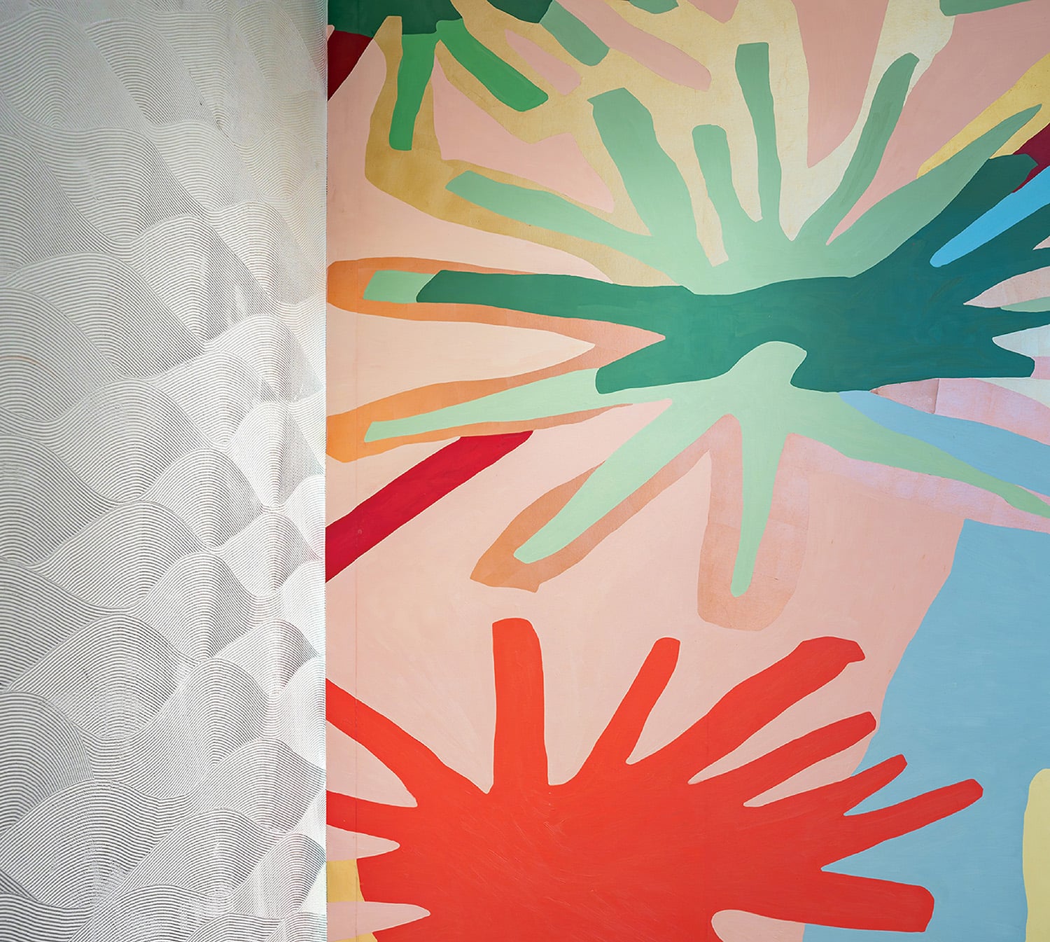 A painting of a bunch of hands on a wall