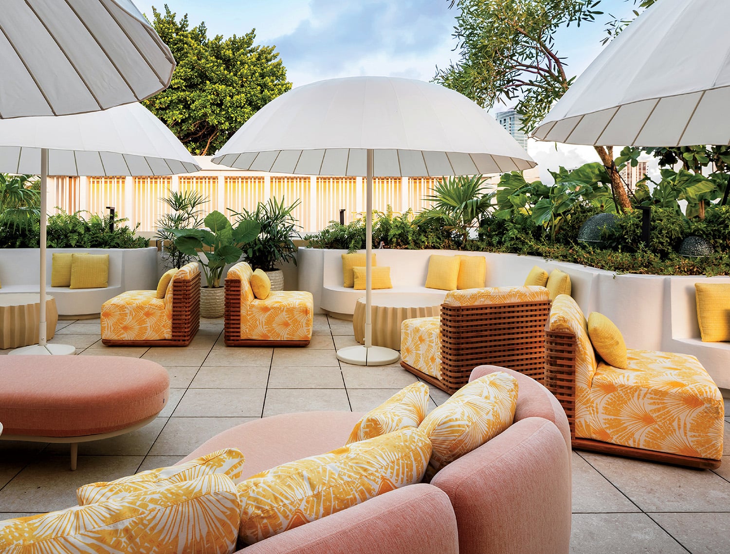 A group of chairs and umbrellas on a patio
