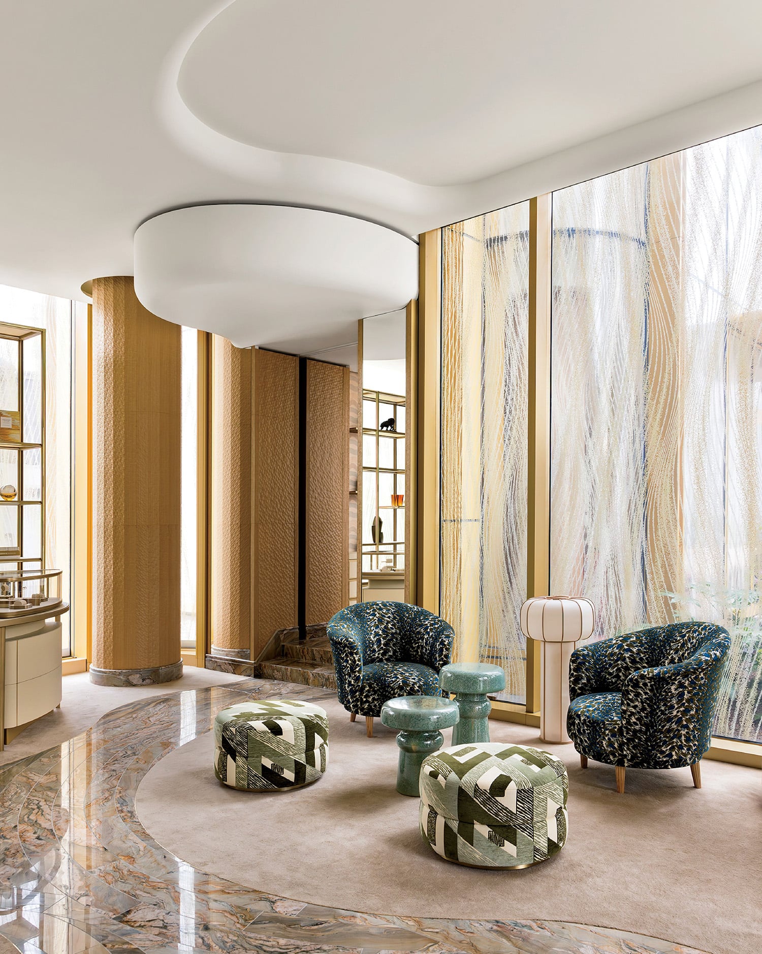 A living room with a marble floor and a large window.