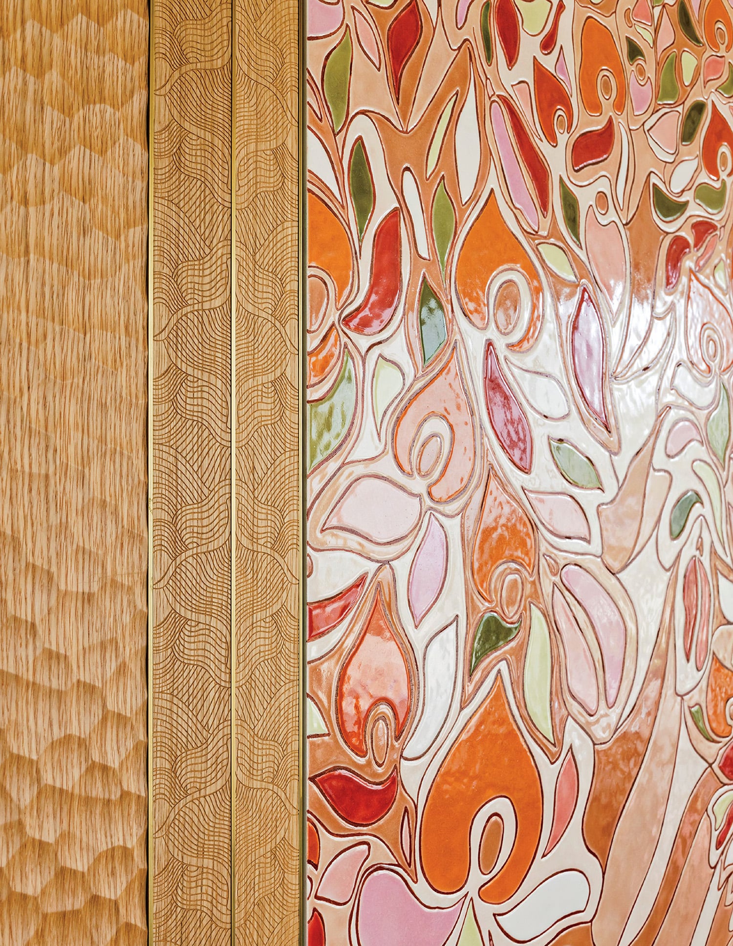 A picture of a colorful wall with a cat.