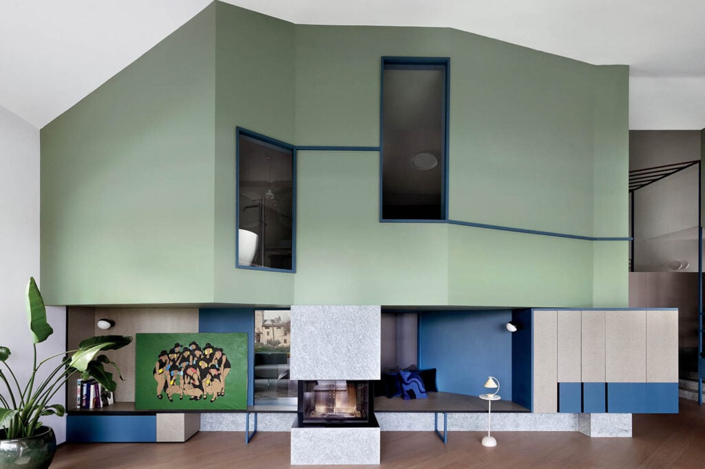 A room with a large green wall and a blue and white wall.