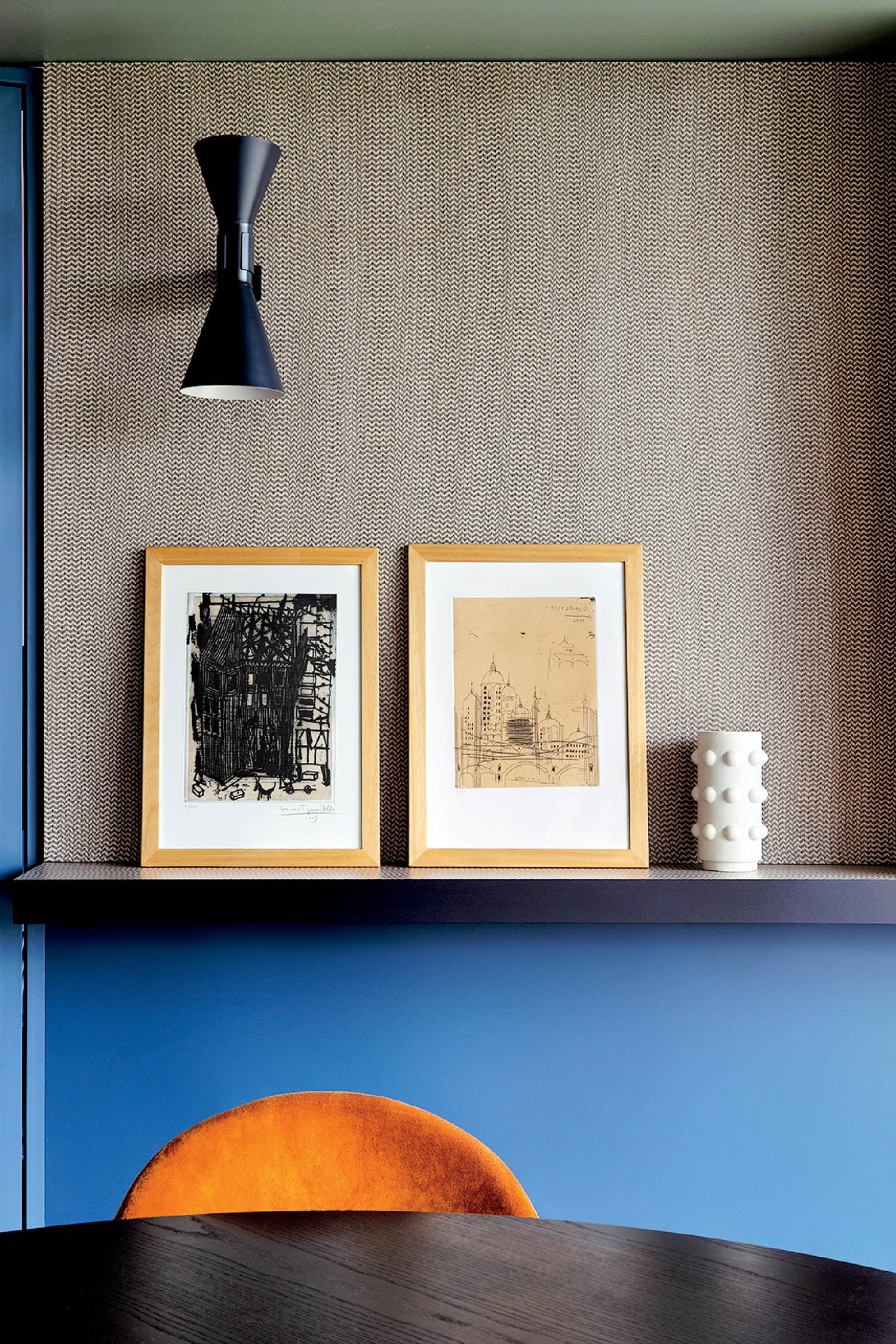 A table with a chair and a picture on it.