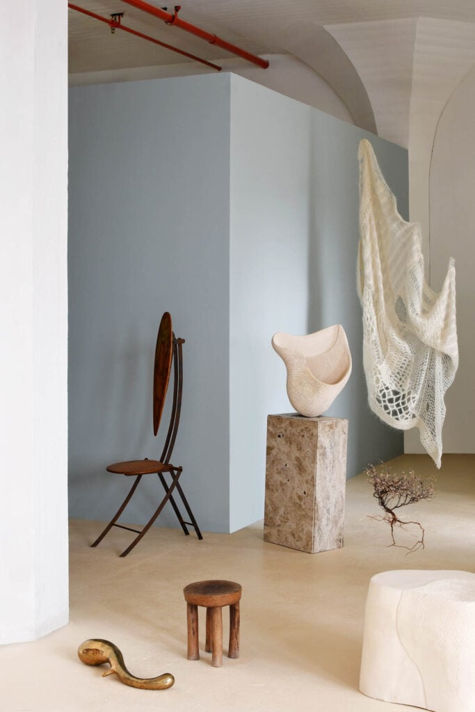 sculptural works near blue wall