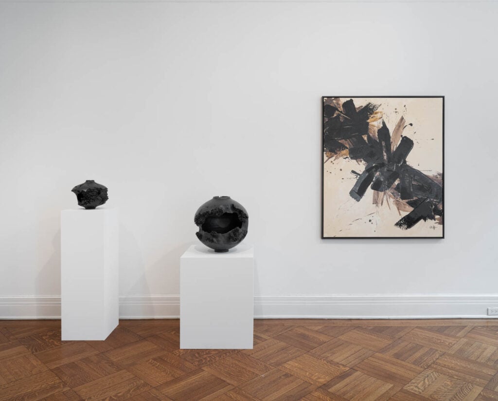 gallery with two sculptures on pedestals