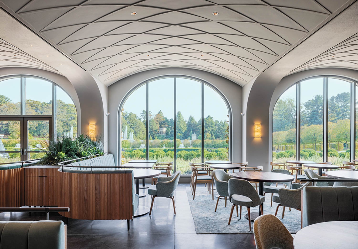arched ceiling with tables below