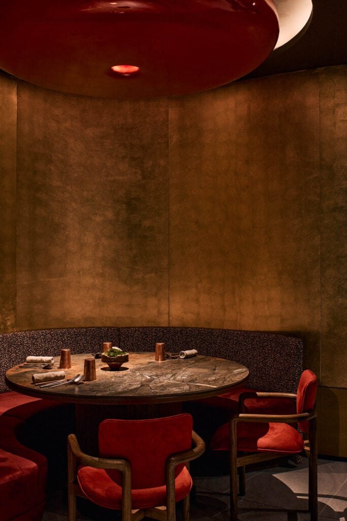 round table with red chairs